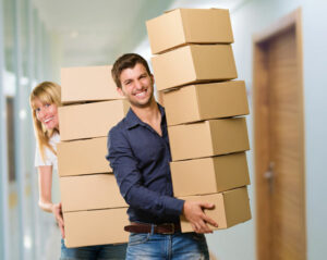 Man and woman holding stack