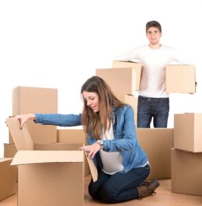 young couple with boxes